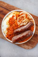 Traditional South African Pap and Wors, sausage with popular maize meal staple covered with...