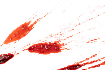 Dripping blood isolated on white background. Flowing bloody stains, splashes and drops. Trail and drips red blood close up.