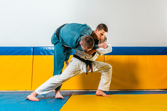 Brazilian jiu-jitsu and grappling training for men in a self-defense gym