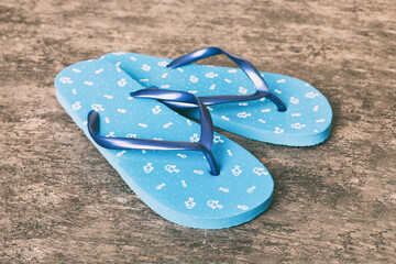 Beach accessories. Flip flops and starfish on colored background. Top view Mock up with copy space