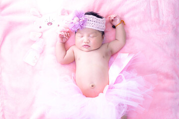 Baby girl in pink skirt,Baby girl in a pink skirt. Selective focus. People,Baby girl newborn in pink tutu 