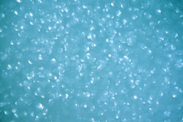 Abstract of shining bokeh glitters for background with copy space. Christmas and New Year wallpaper decorations concept