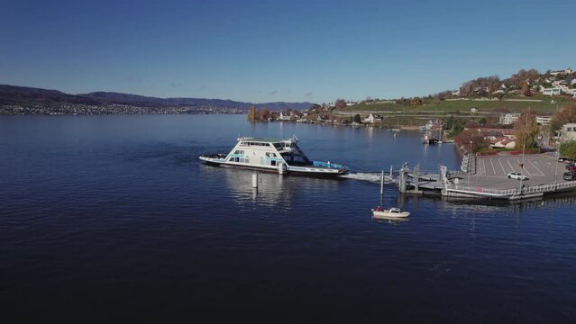 Aerial panoramic drone view of the Horgen to Meilen ferry crossing Lake Zurich, Switzerland