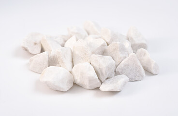 Dolomite mineral stones heep on white background.