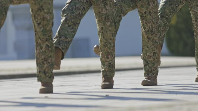 Special force military soldiers march in a row