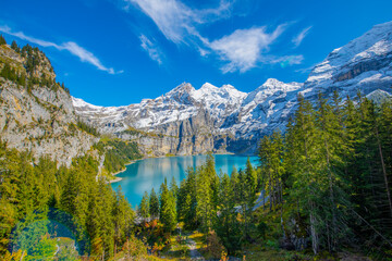 Amazing tourquise Oeschinnensee with waterfalls and Swiss Alps, Kandersteg, Berner Oberland, Switzerland.