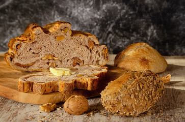 bread with butter on a wooden board