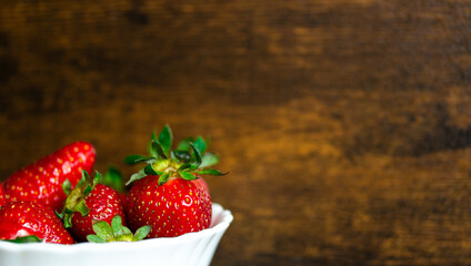 Fresh strawberries on a wooden background