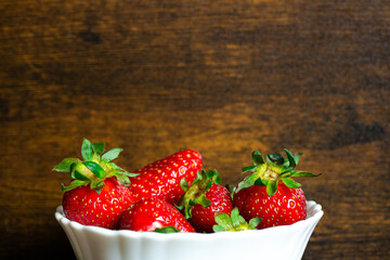 Fresh strawberries on a wooden background