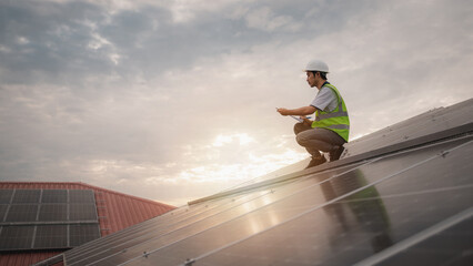 Service engineer checking solar cell on the roof for maintenance if there is a damaged part. Engineer worker install solar panel. Clean energy concept..