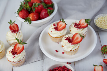 Strawberry cupcakes in white plate in the kitchen