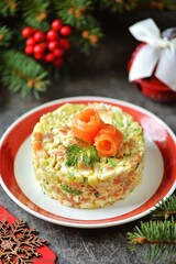 Festive salad with prawns, salted salmon, avocado, cucumber, eggs and mayonnaise