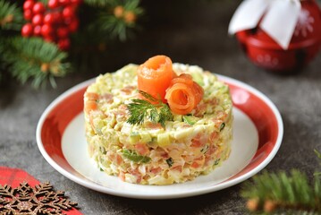 Festive salad with prawns, salted salmon, avocado, cucumber, eggs and mayonnaise