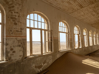 Architectural views of sand filled abandoned homes in diamond mining ghost town.