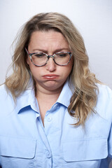 Adult woman in glasses with nausea, on a white background