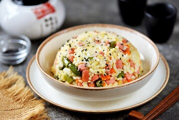 Fried rice with eggs, sausages and vegetables