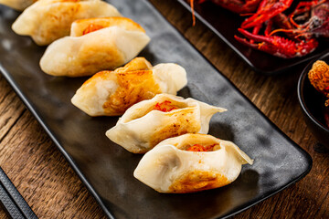 Fried dumplings with crayfish filling