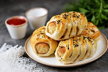 Cutlet in puff pastry with sesame seeds. Traditional Russian homemade fast food