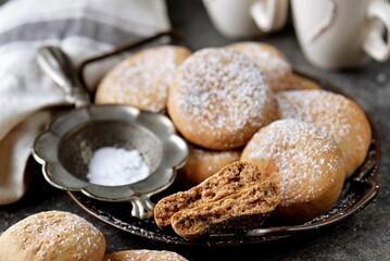 Homemade gingerbread with cocoa and powdered sugar.
