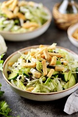 Healthy Chinese cabbage salad with cucumbers, green onions, black beans and croutons.