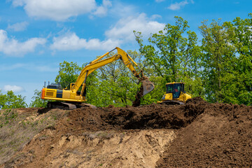 crawler excavator front view digging on demolition site