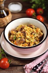 Chicken gizzards stewed with vegetables and bulgur.