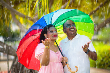 Young Indian couple in love in rain