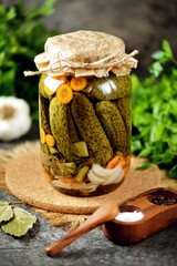 Homemade pickled cucumbers with carrot, and onions.