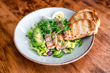 Grilled chicken spring salad with bread