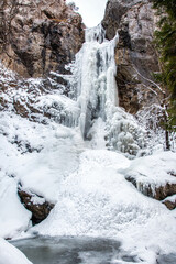 Frozen waterfall Cervene piesky in valley Prsiecka dolina in Slovakia