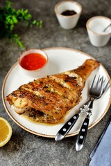 Sea fish baked with herbs, garlic, lemon juice and soy sauce