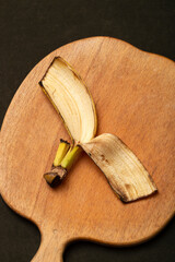 Part of the banana peel on the kitchen board