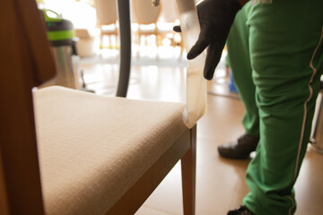 Chemical sofa cleaning with professional extraction method. upholstery and chairs