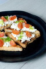 Toast with fresh cottage cheese and cherry tomatoes
