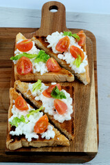 Toast with fresh cottage cheese and cherry tomato