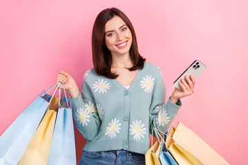 Photo portrait of young optimistic woman wear turquoise cardigan hold phone order more clothes...