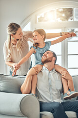 Mom, dad and child on sofa with flying game, piggy back and playful fun in living room for happy...