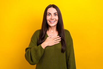 Portrait of cheerful impressed person hand touch chest beaming smile isolated on yellow color background