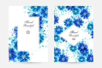 Romantic background with blue cornflowers and paint splashes.