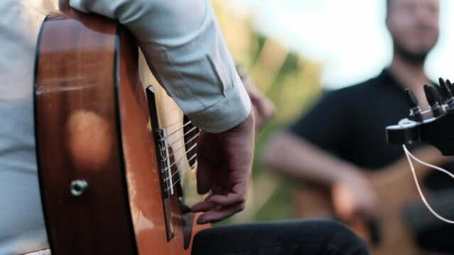 Man Playing Guitar In A Band.