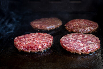 Hamburger. Hamburgers cooking on the grill