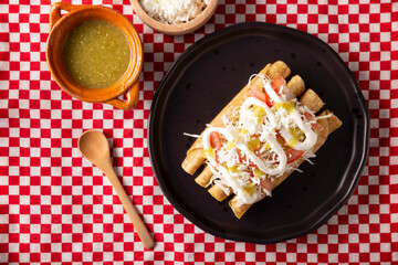Tacos Dorados. Mexican dish also known as Flautas, consists of a rolled corn tortilla with some filling, commonly chicken or beef or vegetarian options such as potatoes.