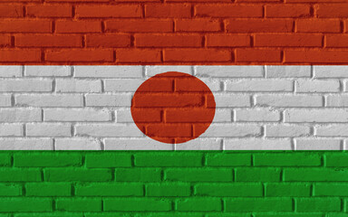 Niger country national flag painting on old brick textured wall with cracks and concrete concept 3d rendering image realistic background banner