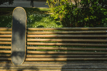 skateboard put on a bench in the park © Jimmy