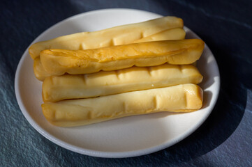 Cheese collection, Italian yellow smoked caciocavallo or scamorza cheese sticks from Puglia