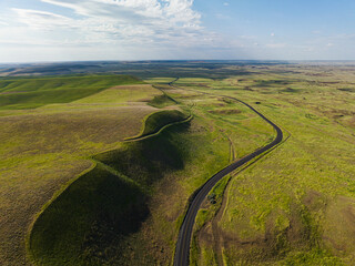 Winding road in green prairie