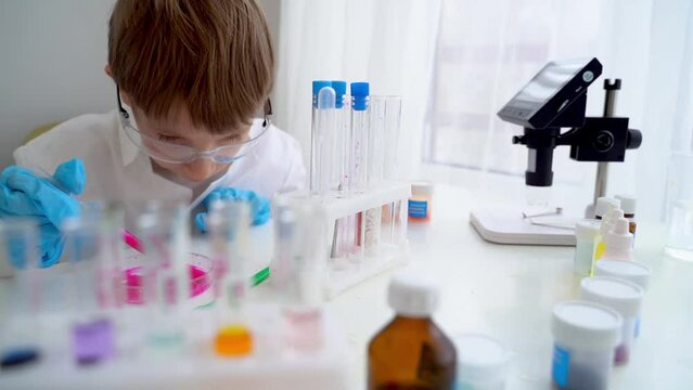 Children perform chemical experiments with a white liquid