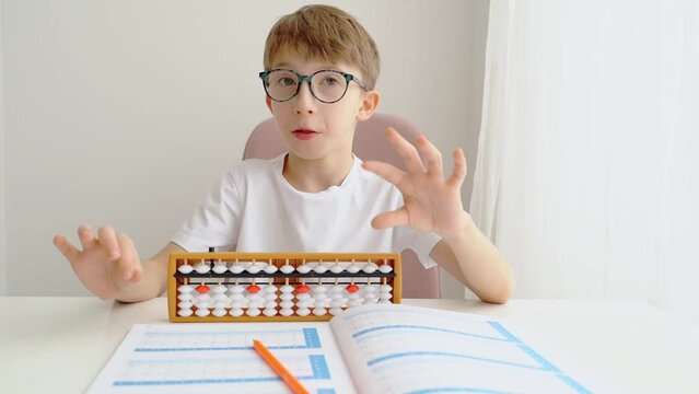 The boy is engaged in abacus, mental arithmetic for children