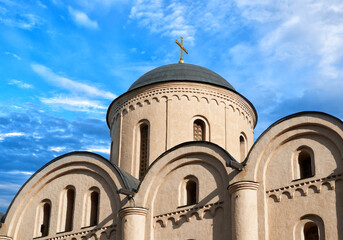 Fototapeta na wymiar Domes of the Pyrohoshcha Dormition of the Mother of God Church on Podil against the blue sky in Kyiv. Kiev, Ukraine