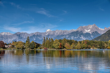 Fototapeta premium The lake of Zell am See in autum. Alpine landscape in fall. Salzburger Land in Austria